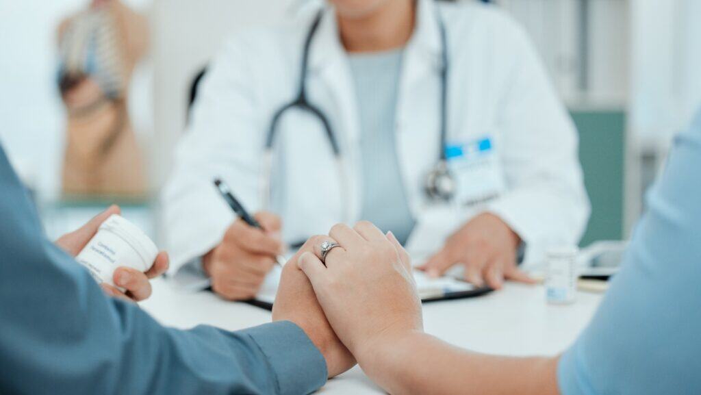 couple meeting with doctor.