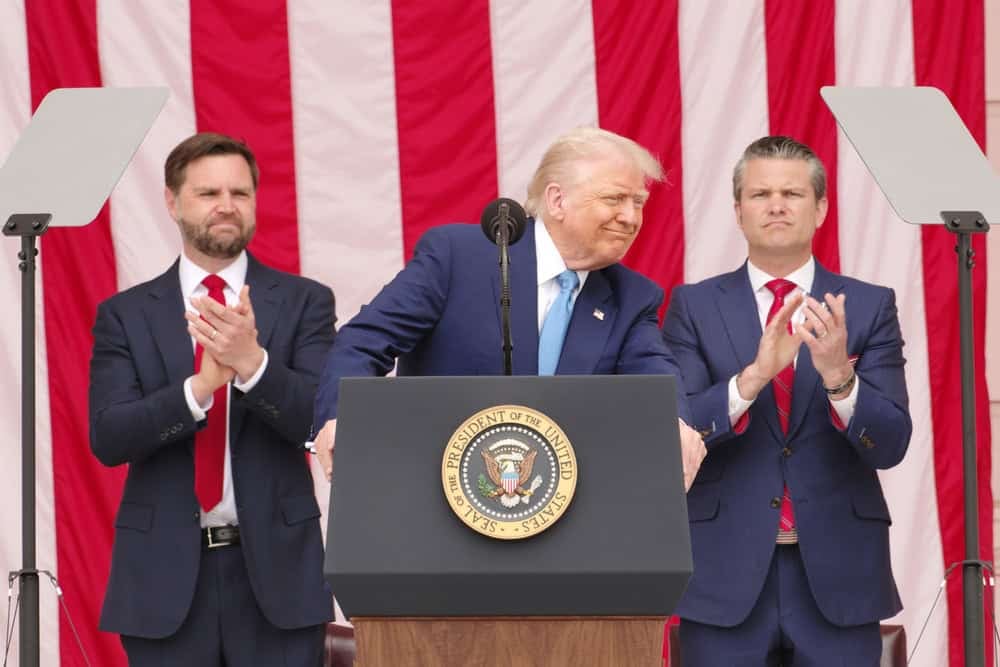 ARLINGTON, VA, USA - May 26, 2025: U.S. President Donald Trump acknowledges the applause from assembled guests at the National Memorial Day Observance at Arlington National Cemetery.