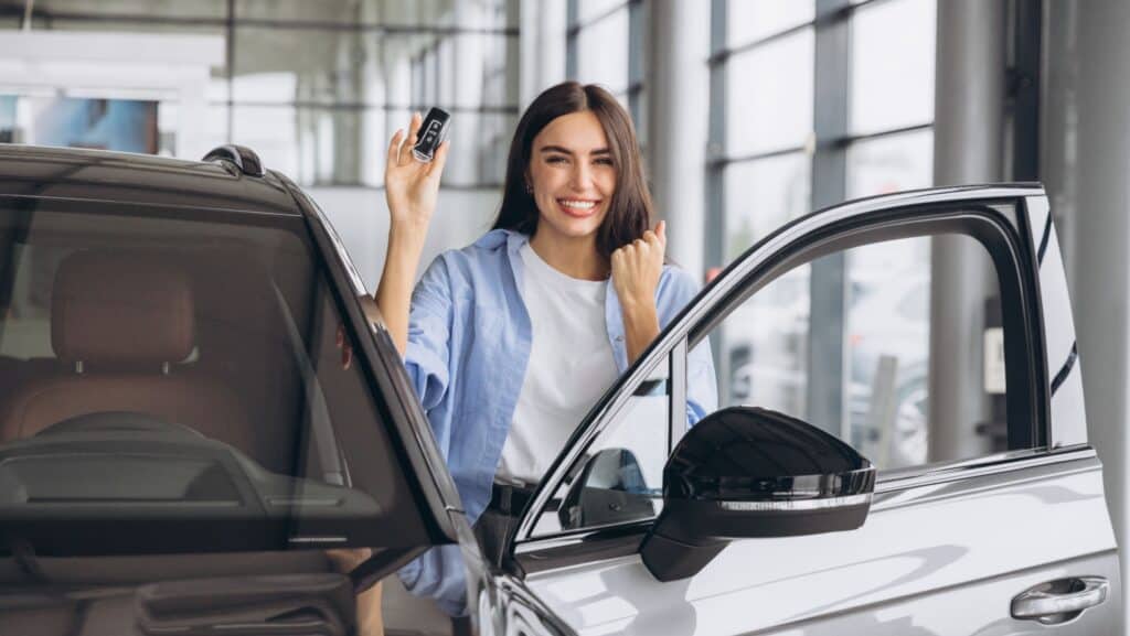 woman with new car.