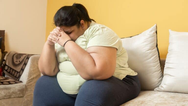 heavy person. depressed, sad.