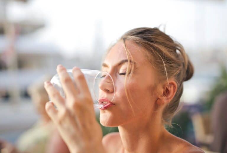 Woman drinking water.