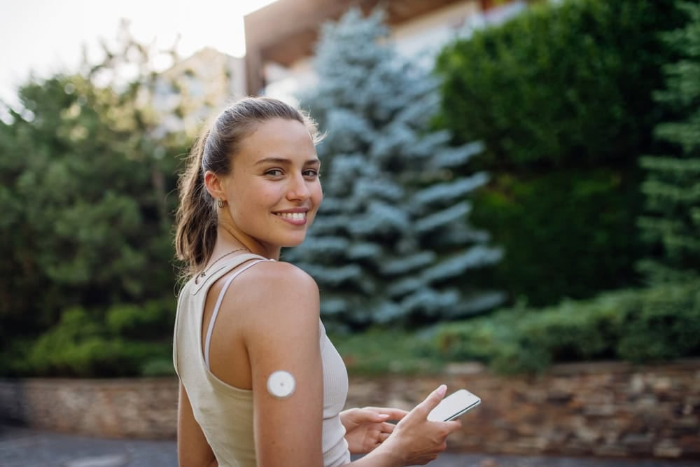 Beautiful diabetic woman preparing for outdoor workout in the city.