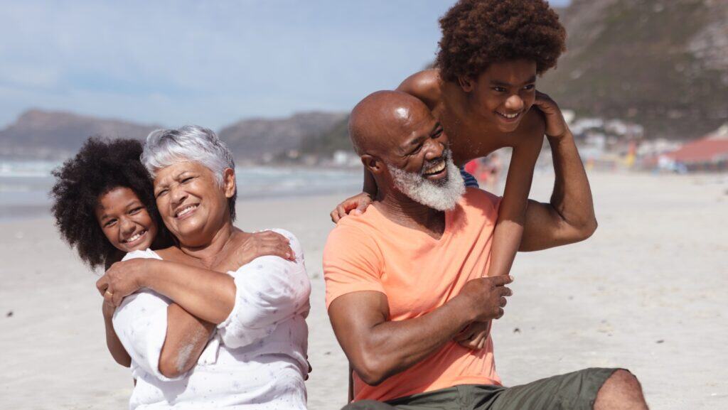 Grandparents and kids at beach.