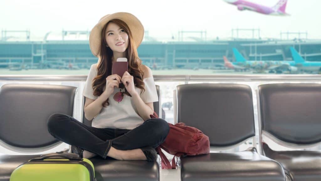 Happy woman in airport.