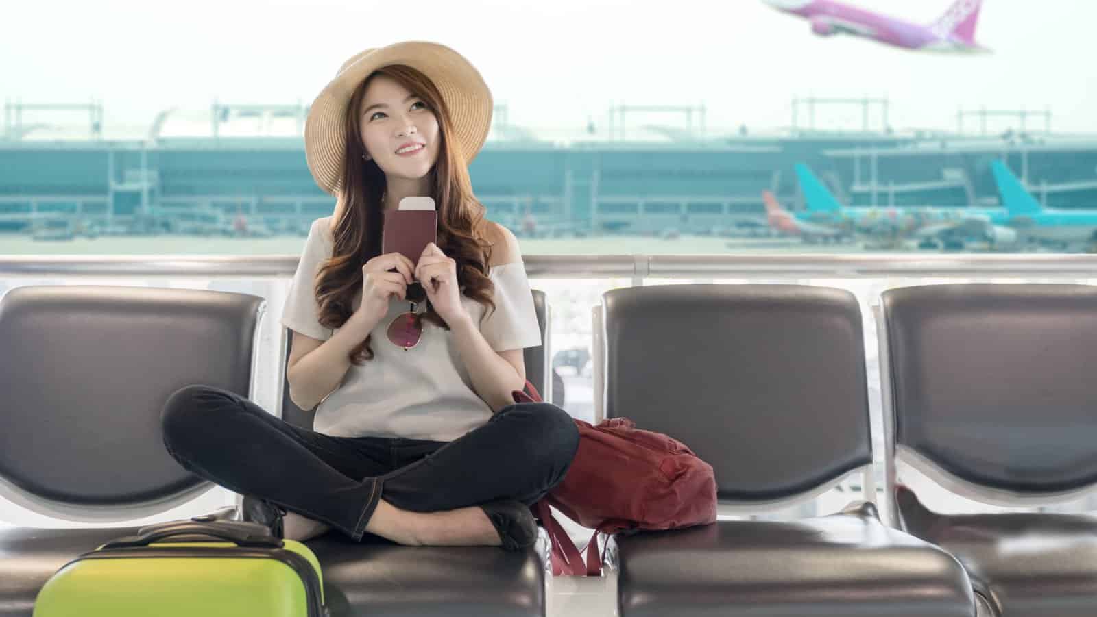 Happy woman in airport.