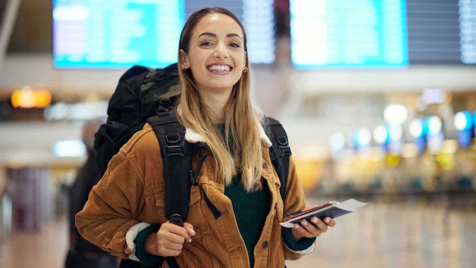 Happy woman in airport.