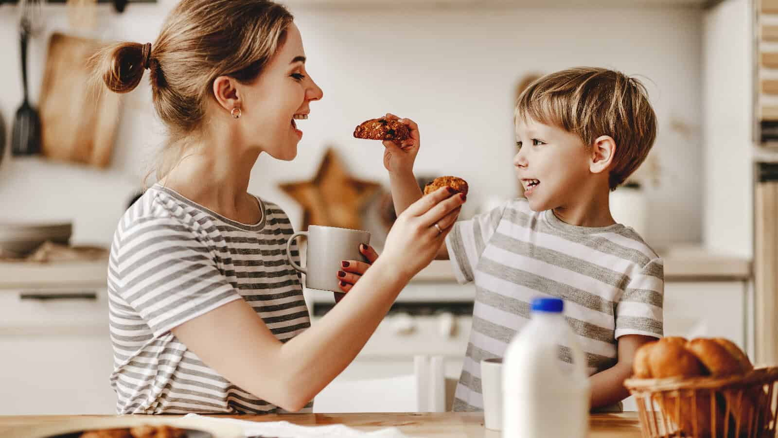 Woman and child feeding bread.
