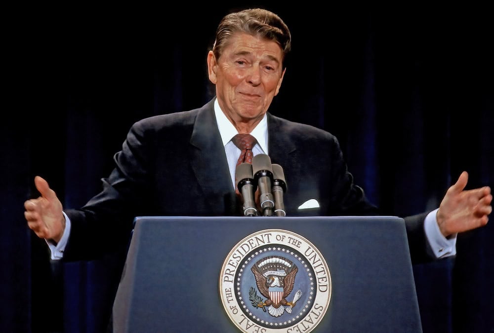 CHICAGO, ILLINOIS, USA  - AUGUST 12, 1986
US President Ronald Reagan gestures while answering a  question from the podium during his 38th news conference held in the the Hyatt Regency Hotel 
