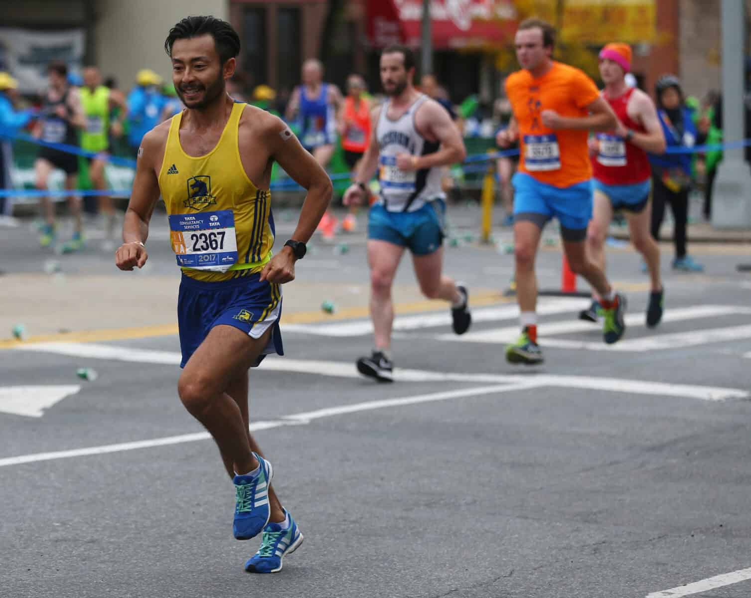 NEW YORK - NOVEMBER 5, 2017: New York City Marathon runners traverse 26.2 miles through all five NYC boroughs to the finish line in Central Park, Manhattan