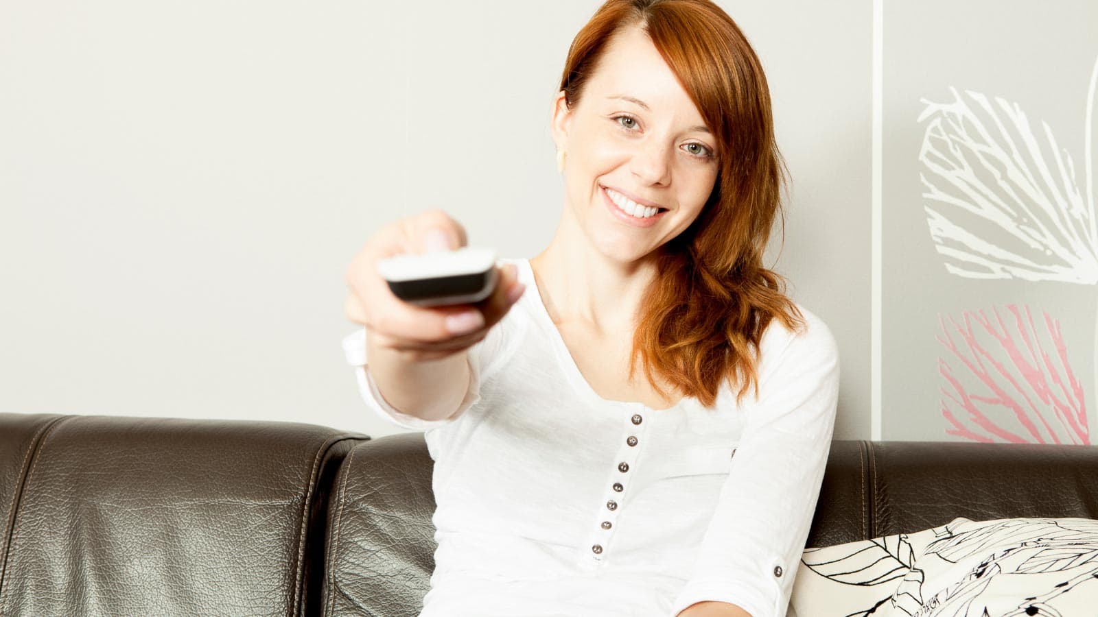 woman with TV remote.