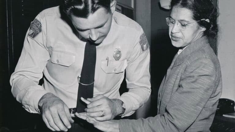Rosa_Parks_being_fingerprinted_by_Deputy_Sheriff_D.H._Lackey_after_being_arrested_on_February_22,_1956,_during_the_Montgomery_bus_boycott.Public Domain.