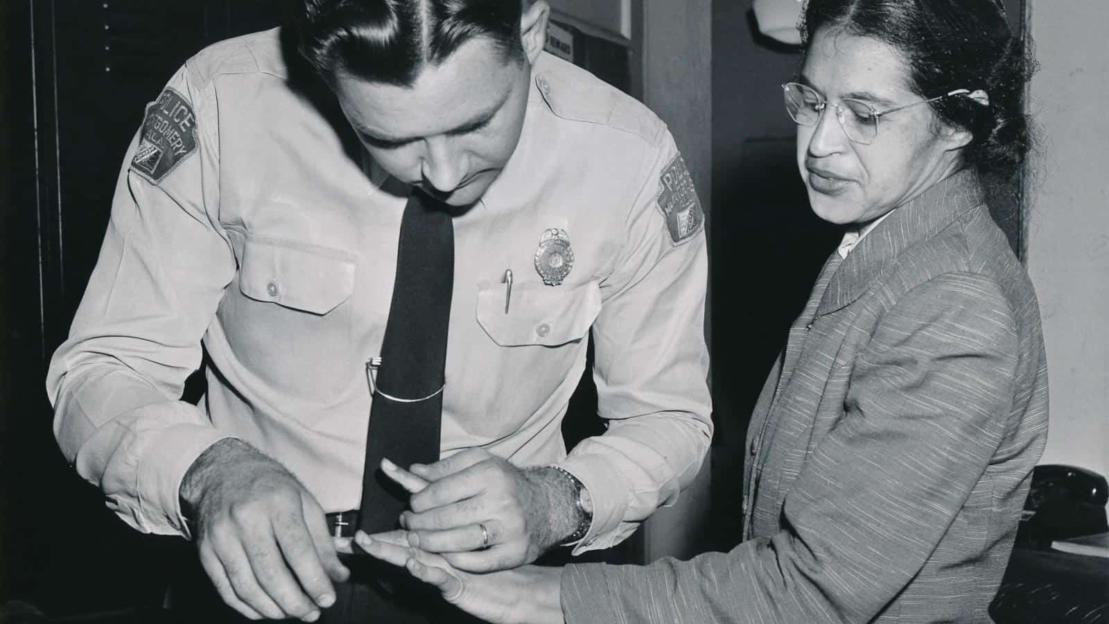 Rosa_Parks_being_fingerprinted_by_Deputy_Sheriff_D.H._Lackey_after_being_arrested_on_February_22,_1956,_during_the_Montgomery_bus_boycott.Public Domain.