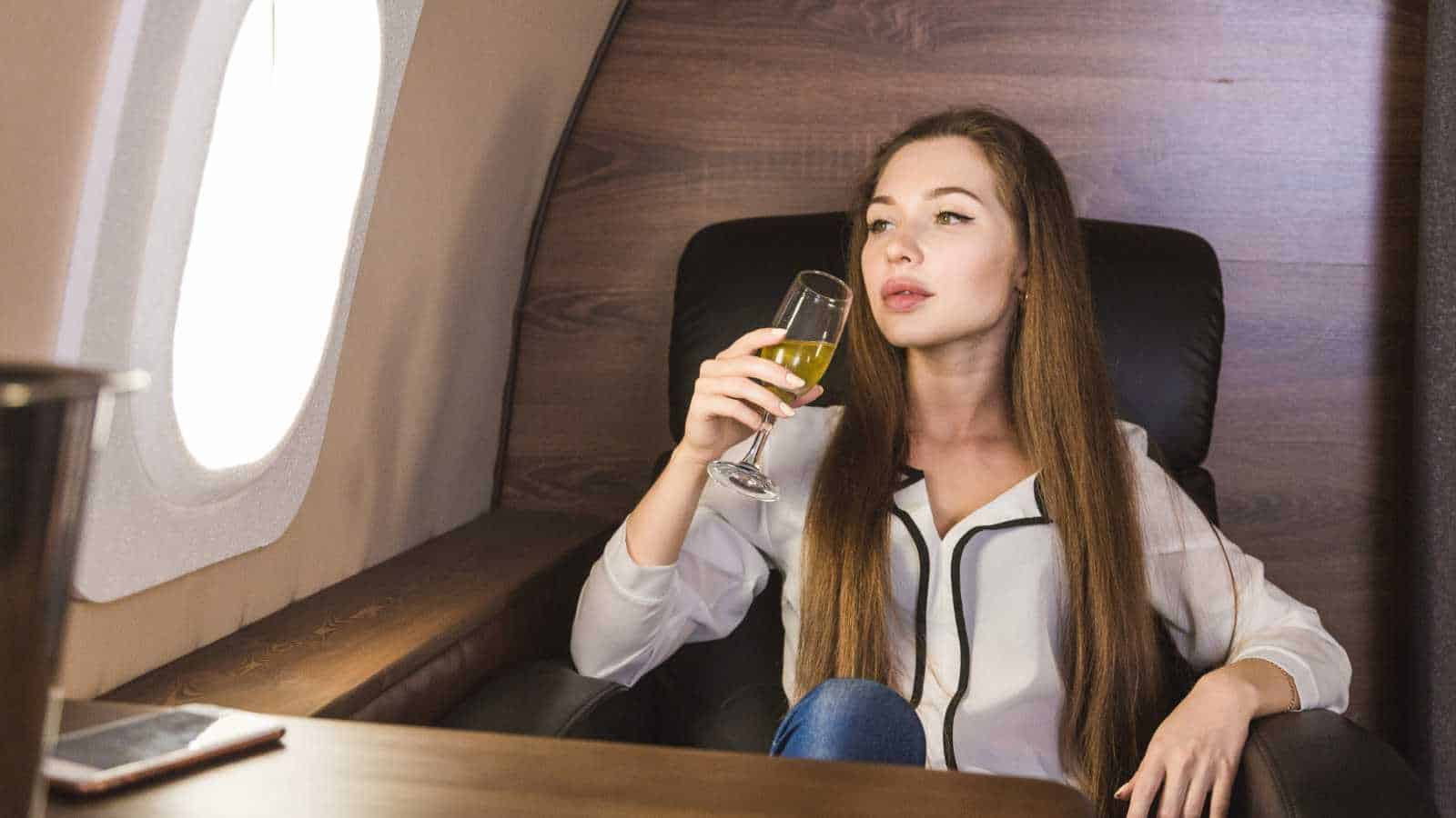 12 Drinks Women Should Avoid Ordering on a Flight