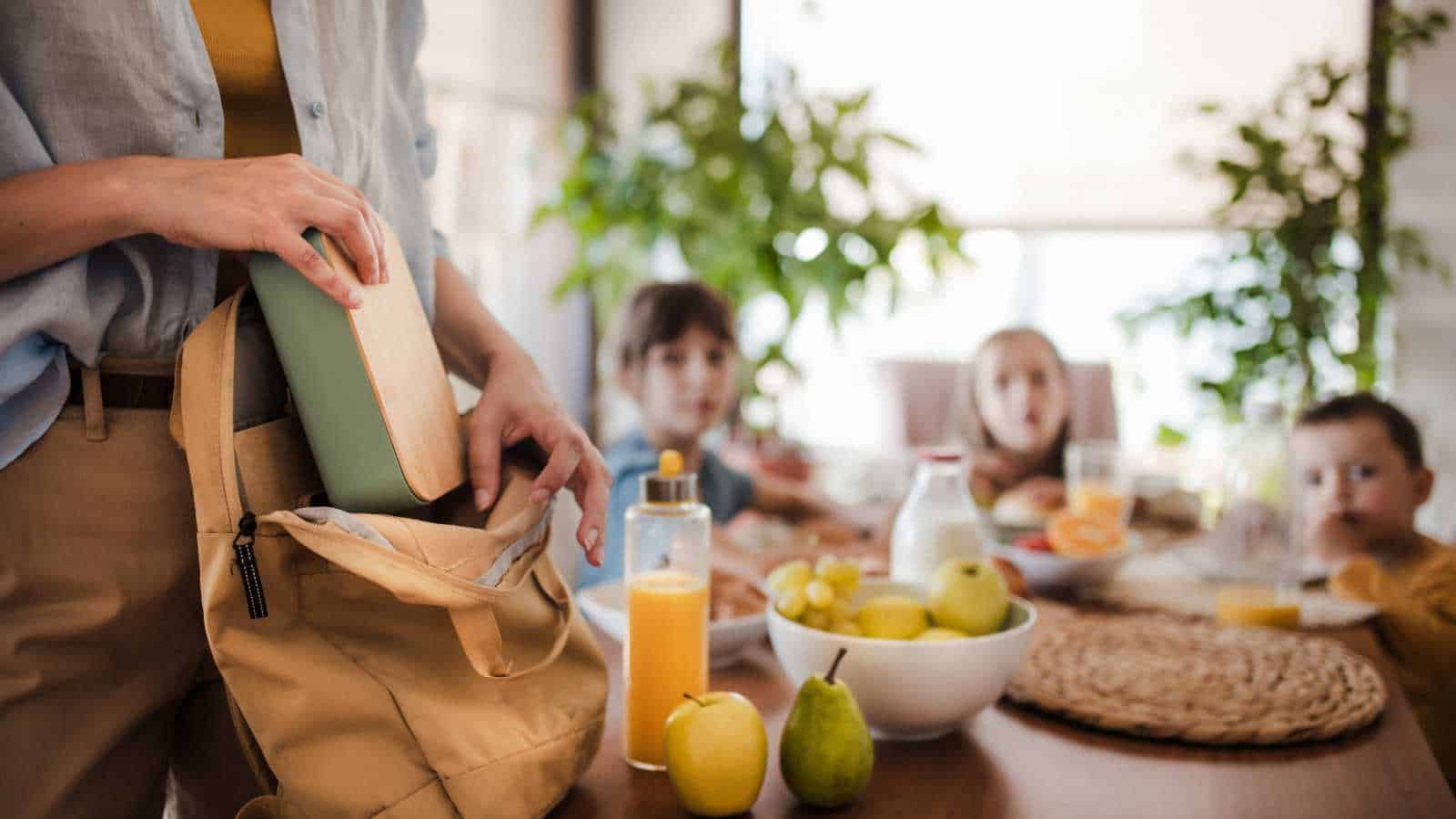 mom with kids in the dining table