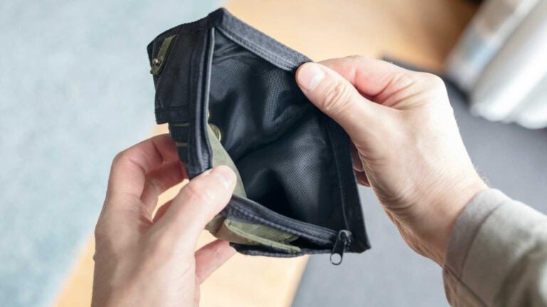 Person with no money in their wallet
