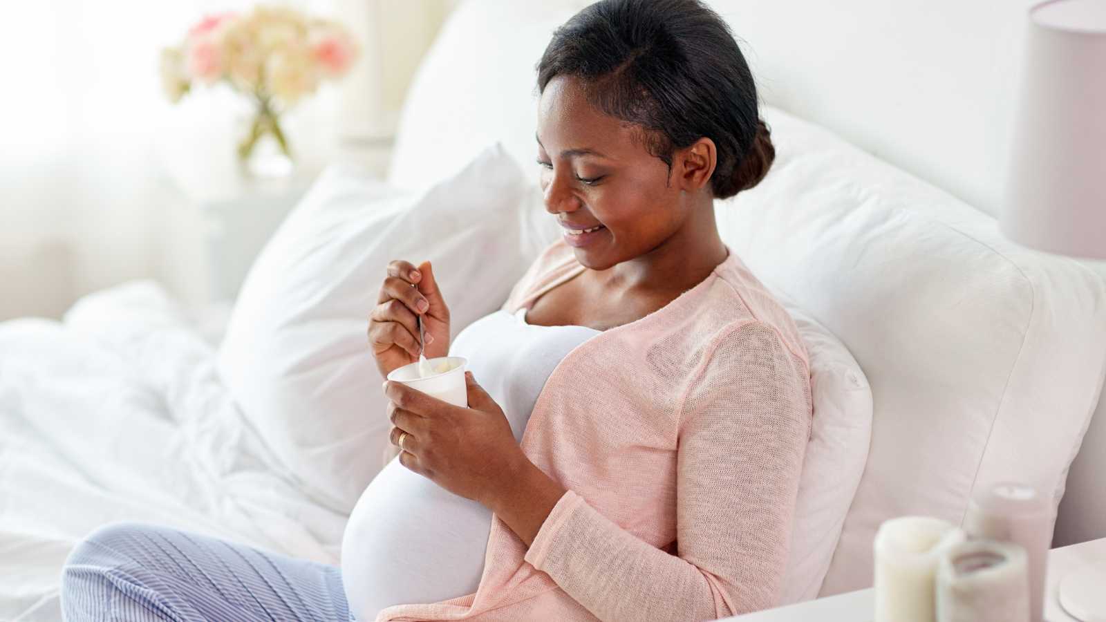 Expectant Woman Taking a Snack