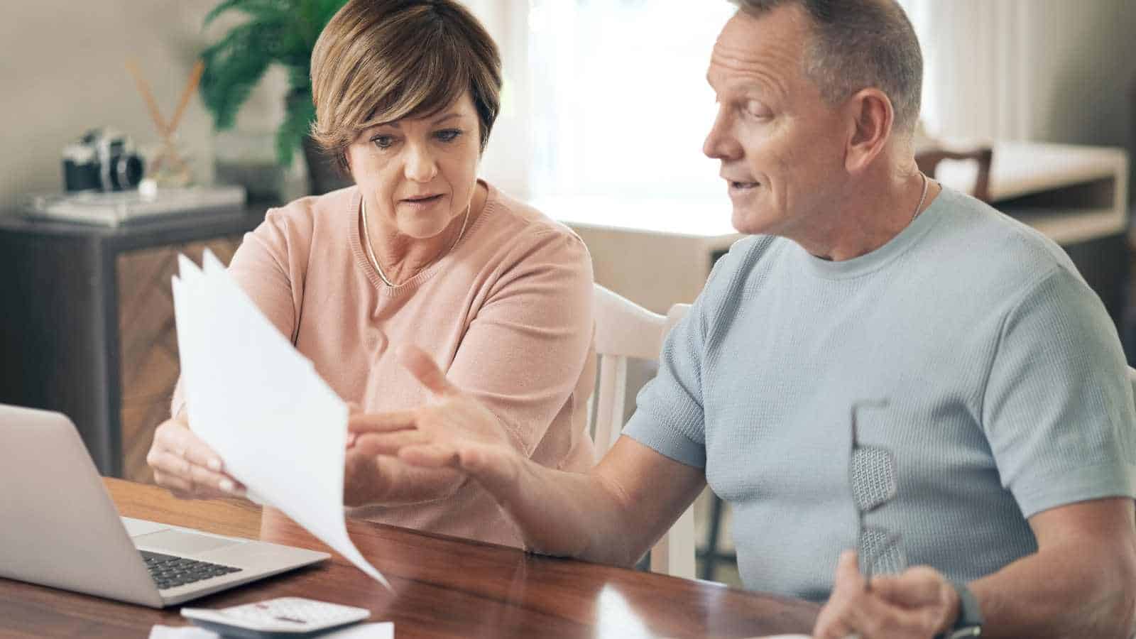Husband and wife checking financial bills