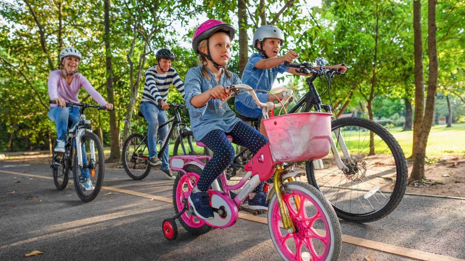 Kids Bike Riding With Their Parents