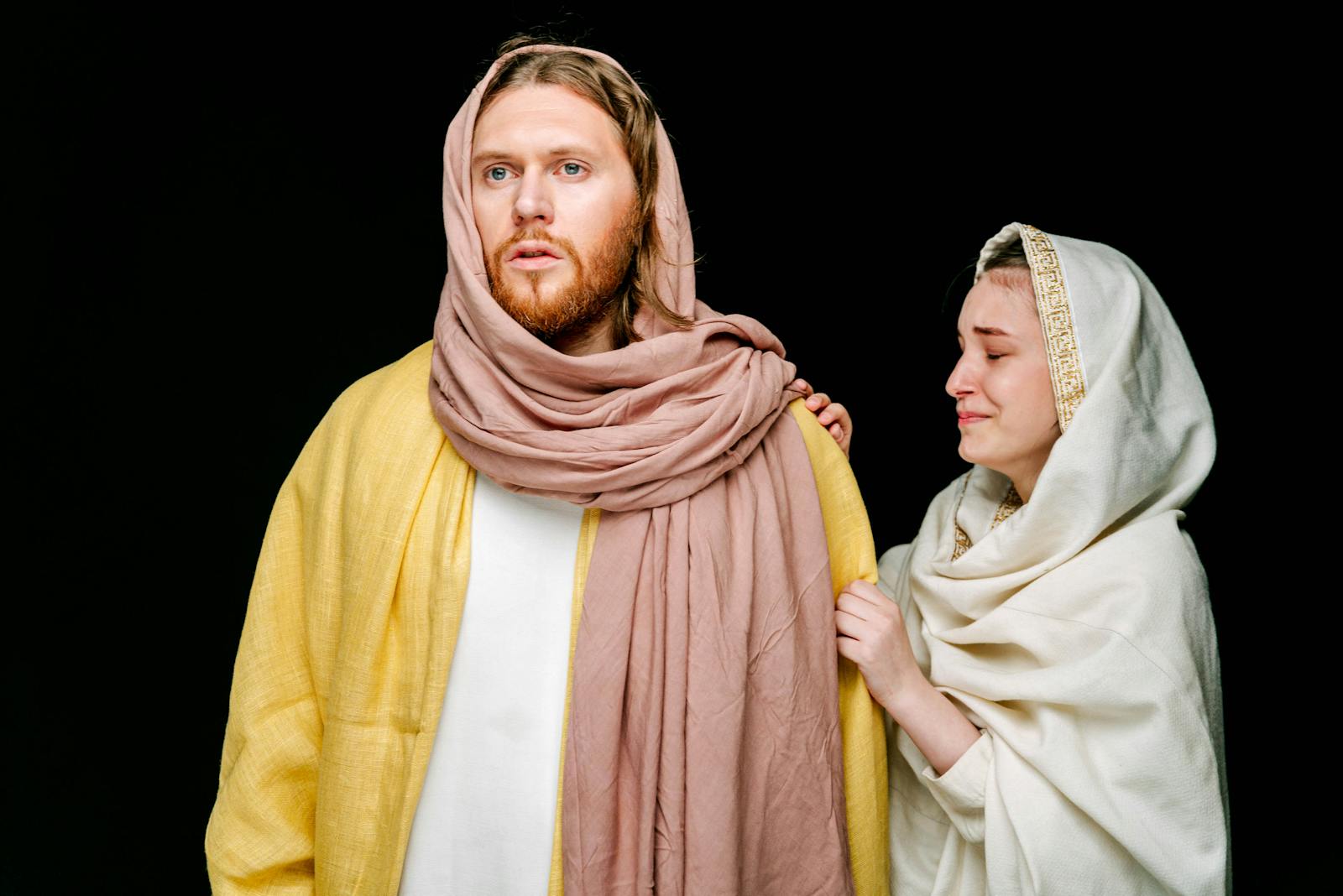 A dramatic portrayal of a biblical scene with a man and woman in traditional costumes.