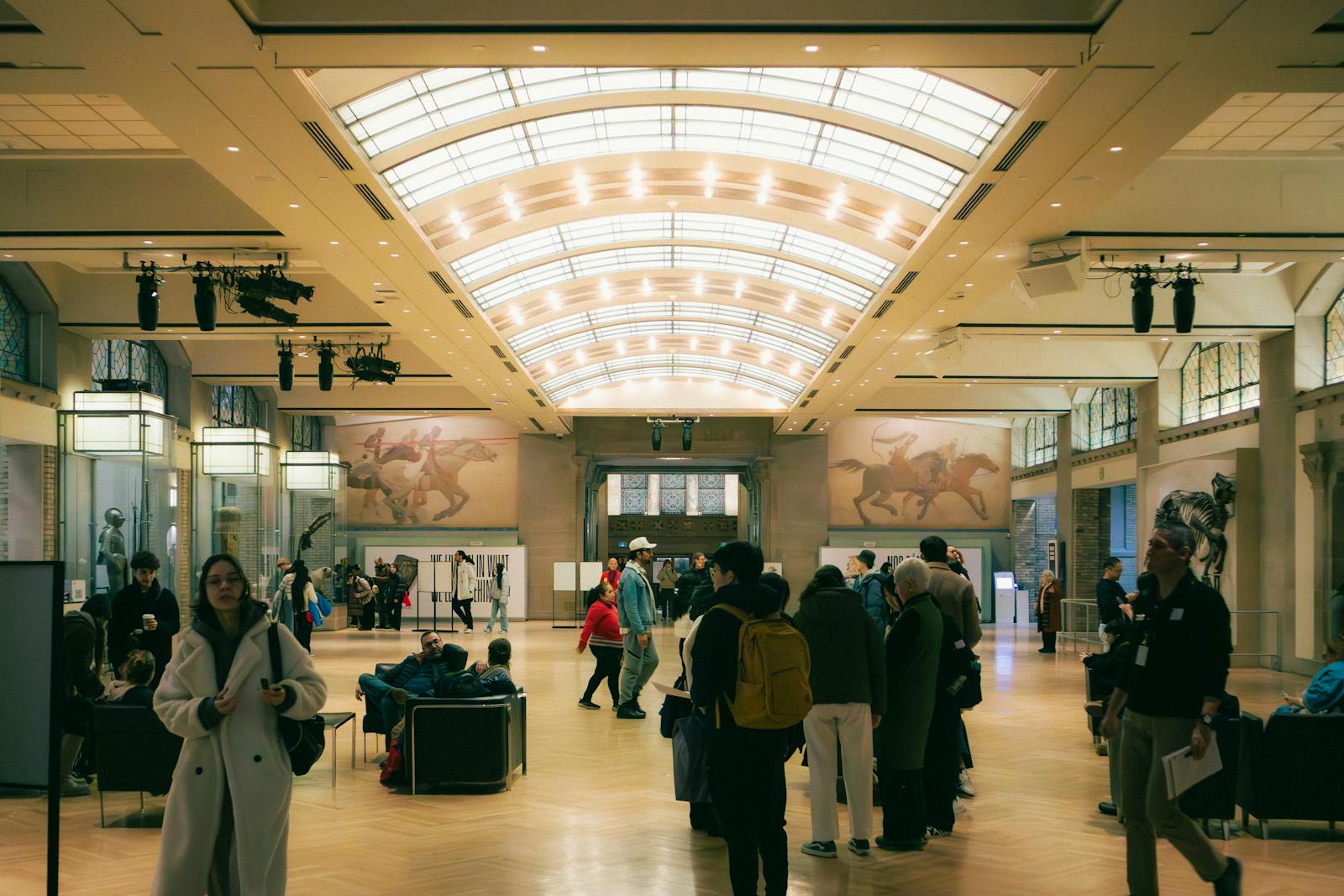 People exploring an art museum exhibit in Toronto, Ontario, Canada.
