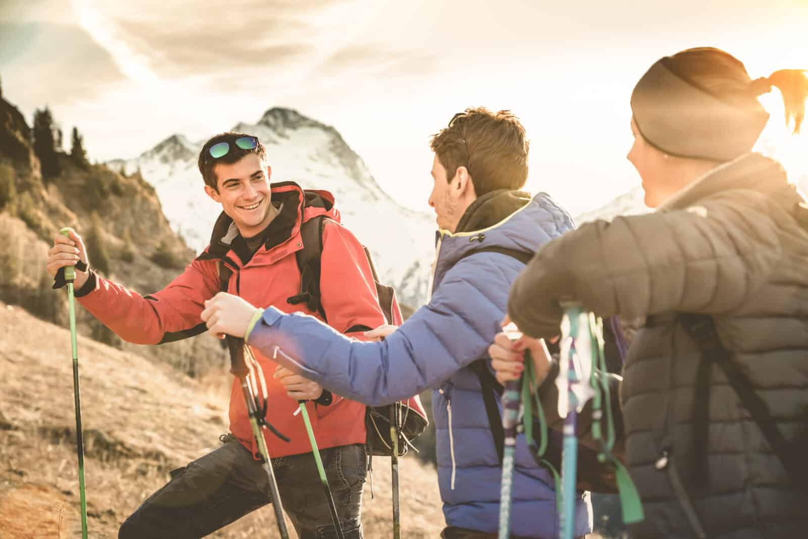 Friends,Group,Trekking,On,French,Alps,At,Sunset,-,Hikers