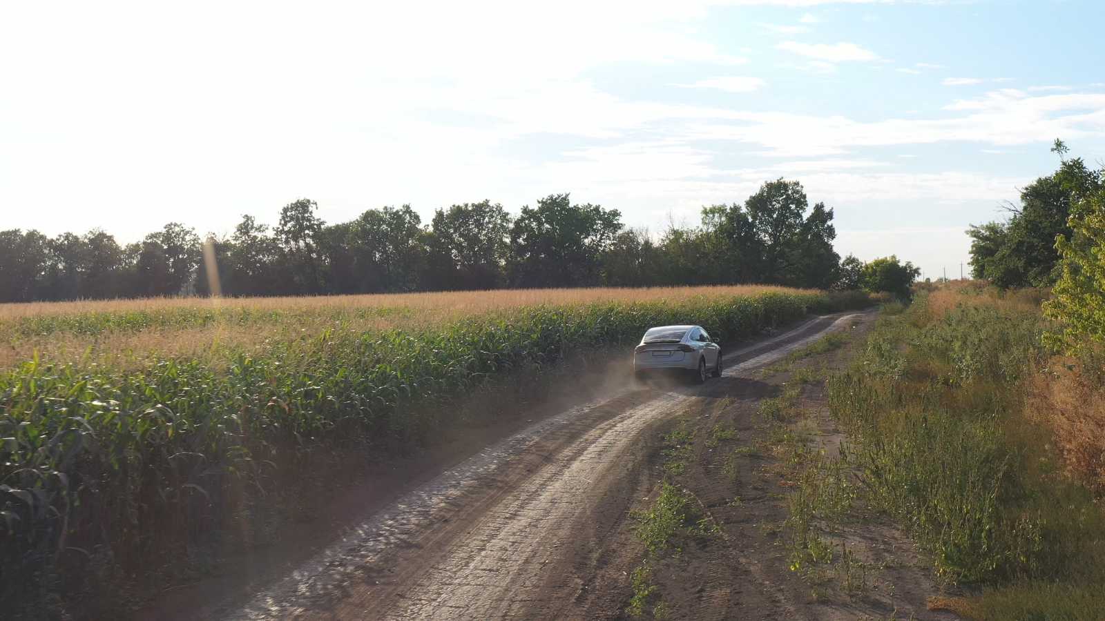 EV in a dusty road
