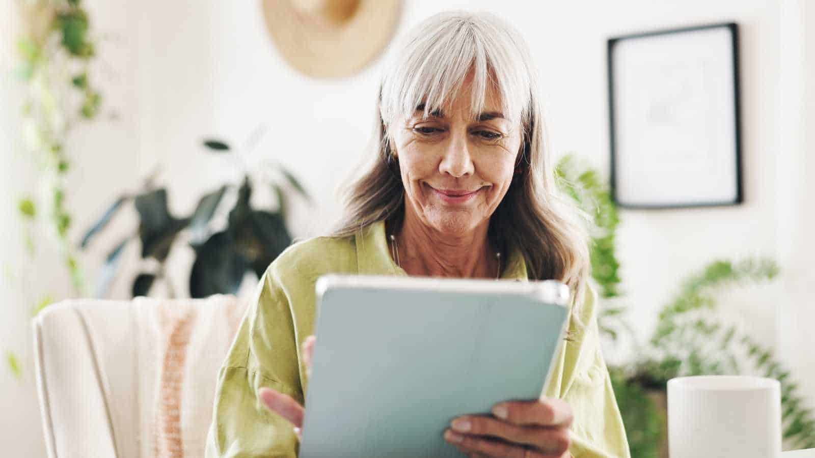 Senior woman using tech
