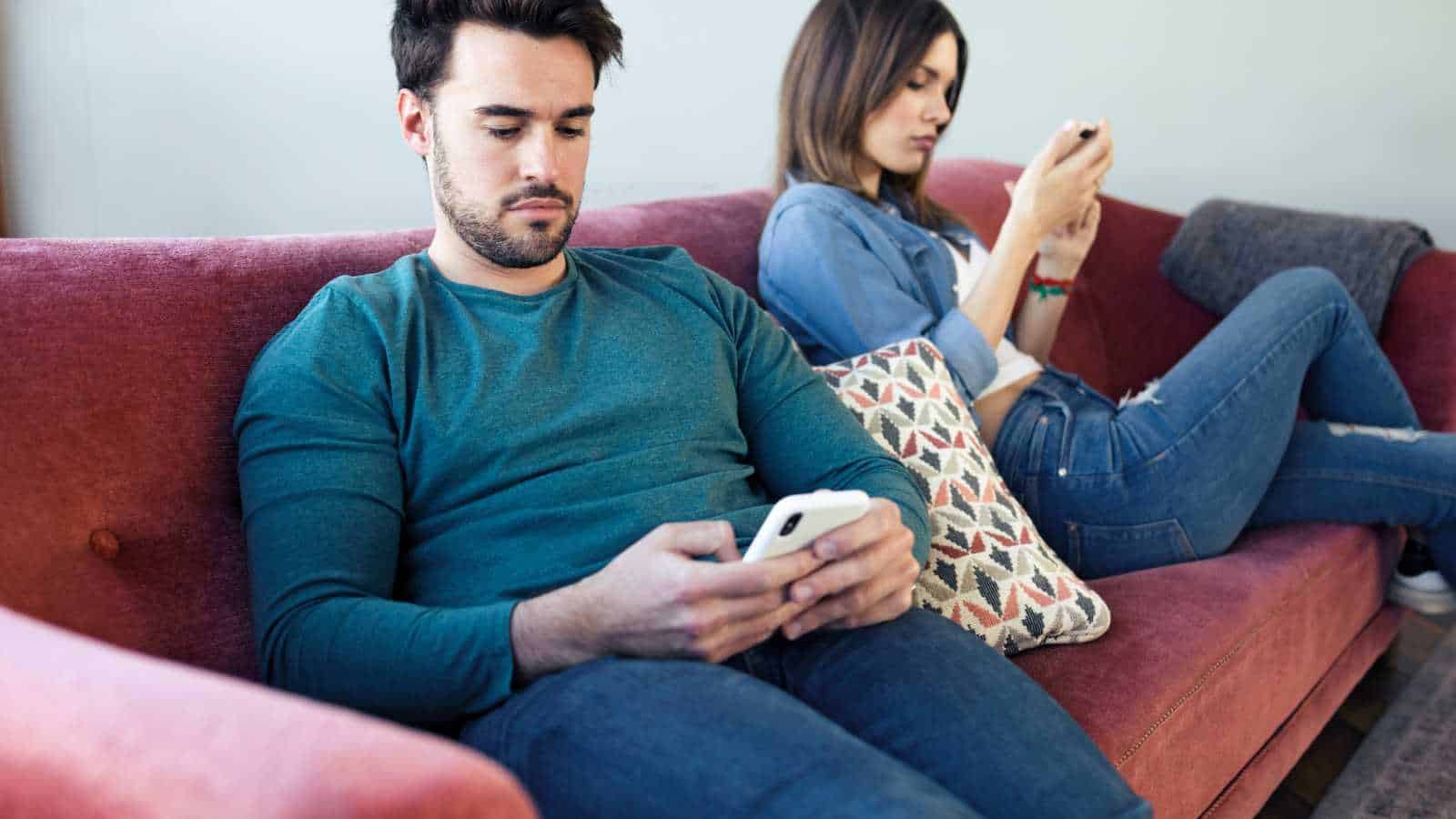 Couple using their phones