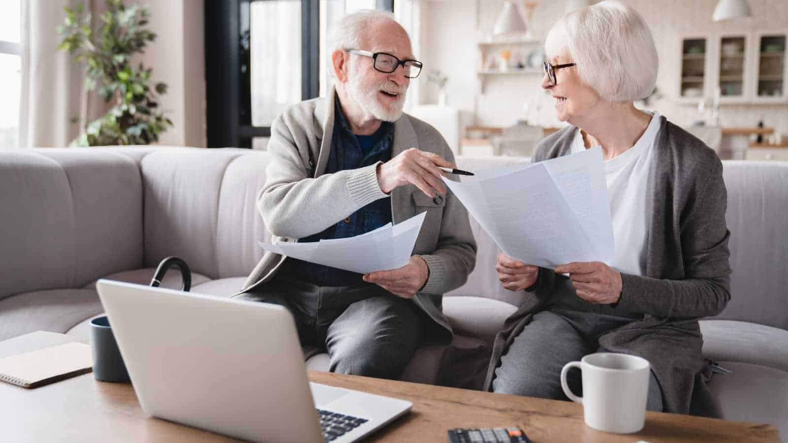 Retired couple checking their tech bills