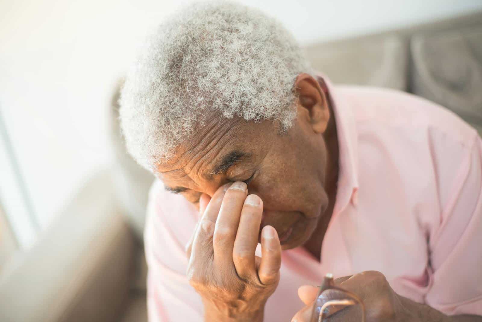 An elderly man with gray hair appears thoughtful in an indoor setting, adding to the contemplative mood. dizzy