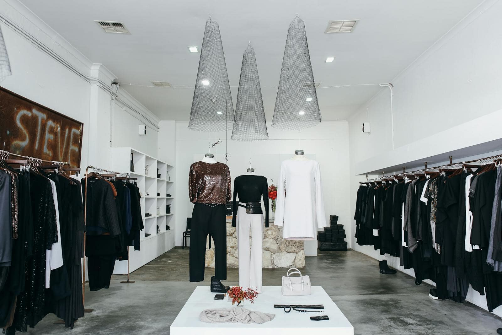 Chic boutique with elegant clothing display and stylish interior design.