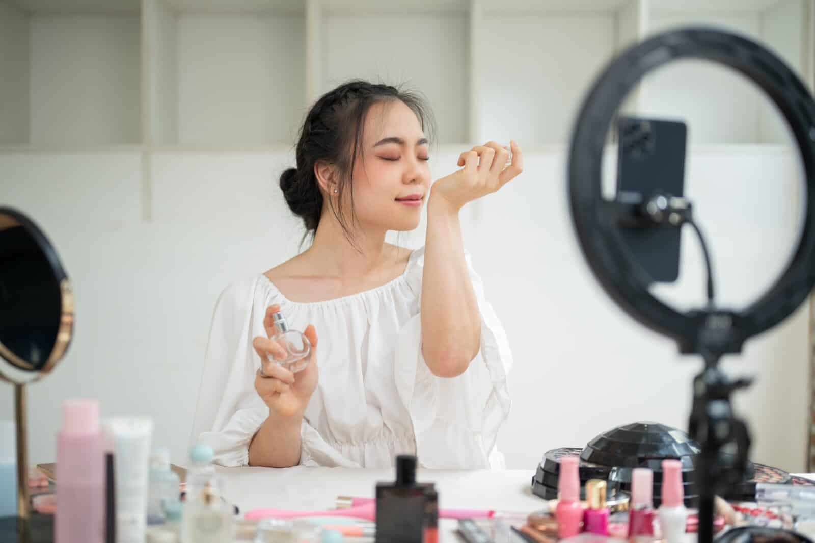 woman smelling her fragrance
