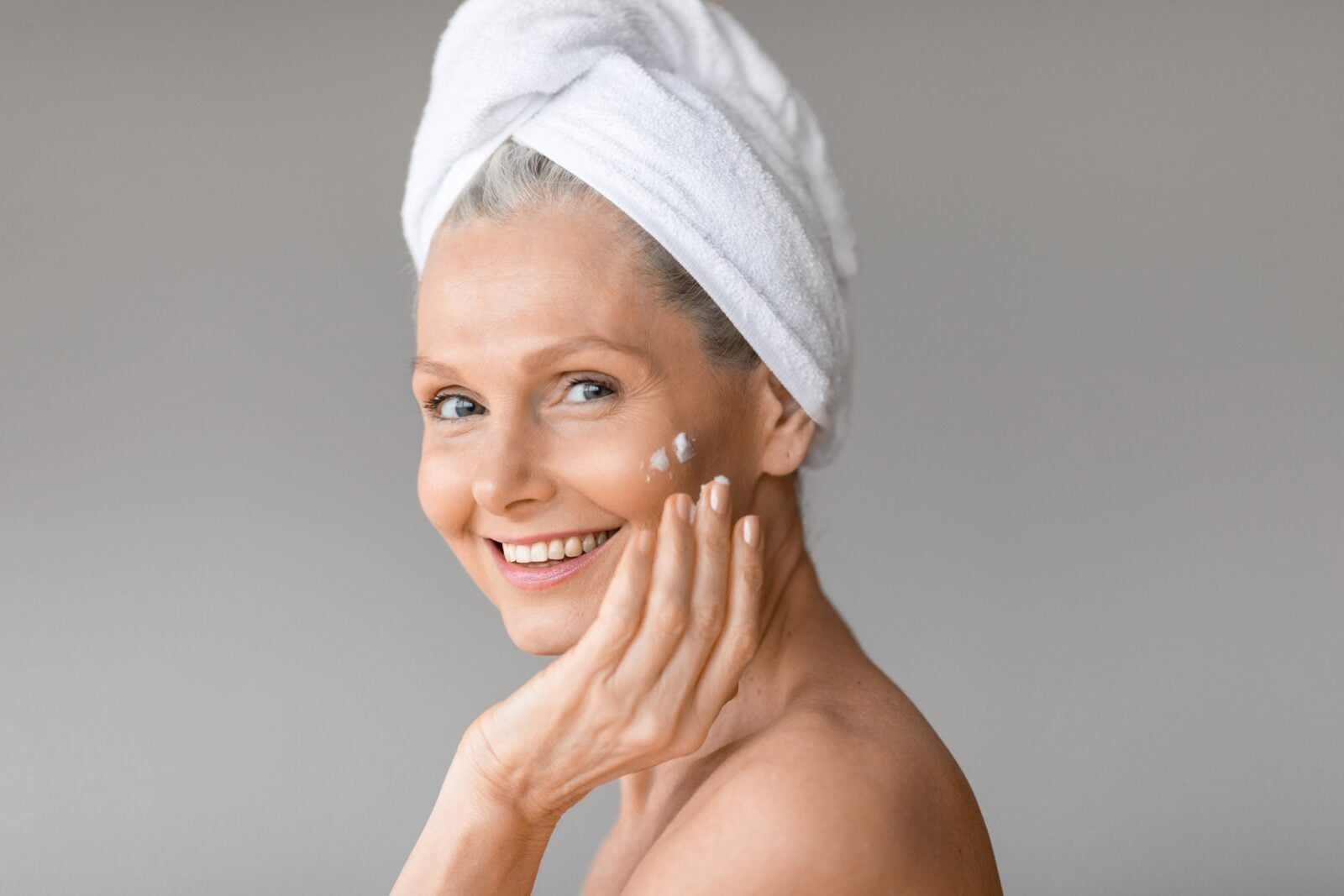 Aged woman nourishing skin
