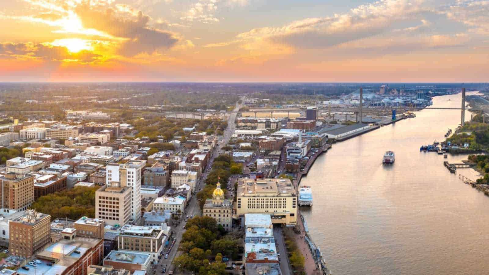 Savannah, Georgia. Famous historic River Street with waterfront tourist attractions. USA cityscape at sunset