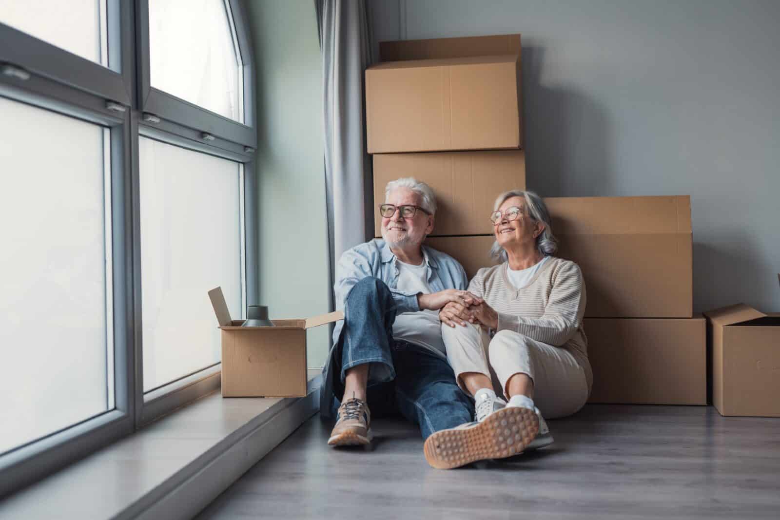 Elderly couple moving into a simple house