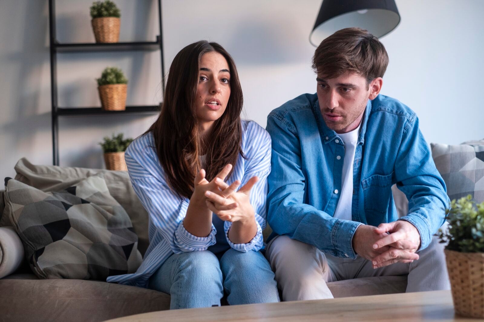 woman telling man score at home