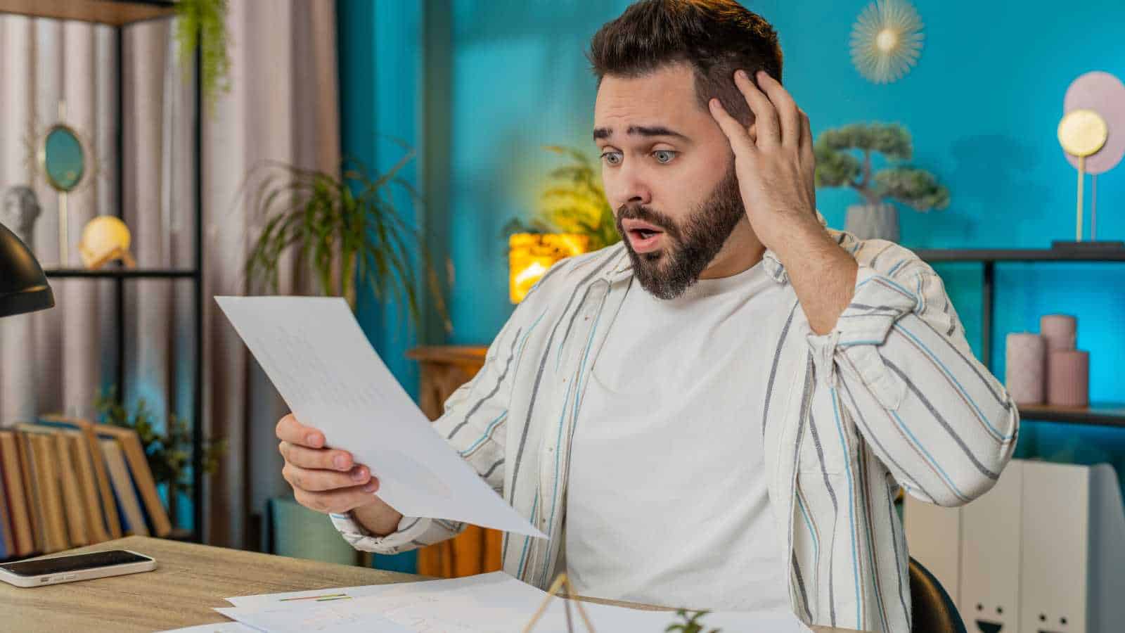 man stressed about bills