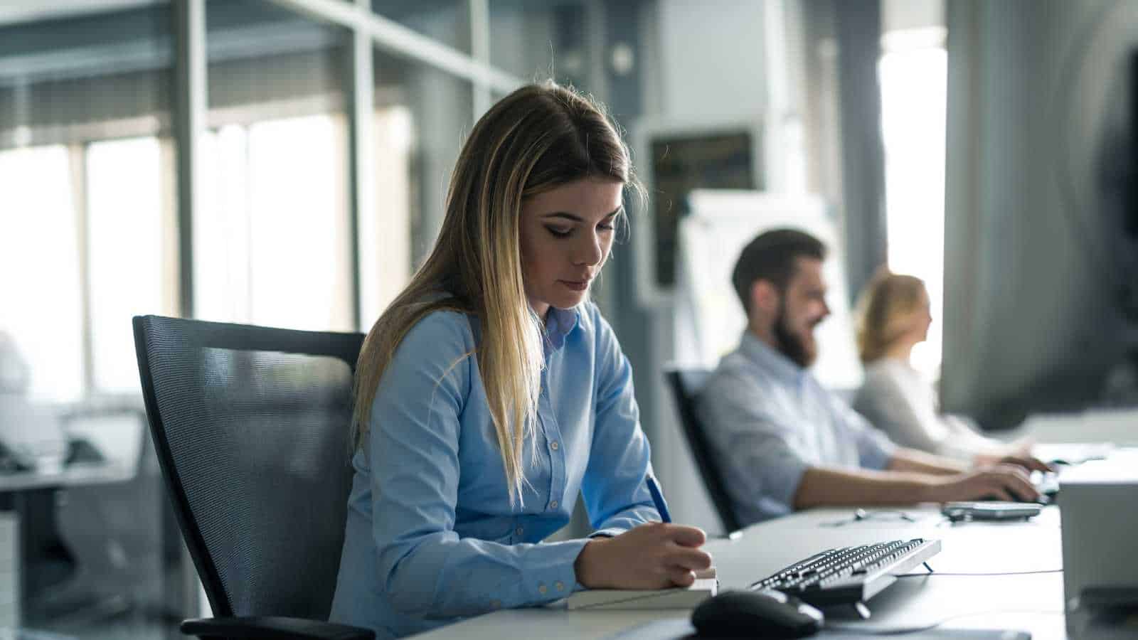 lady taking notes in a meeting