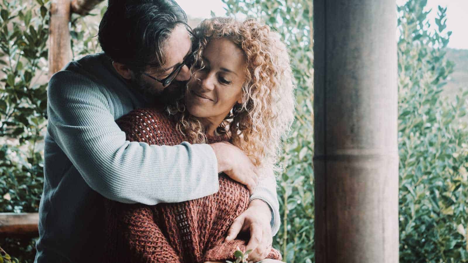 man embracing wife