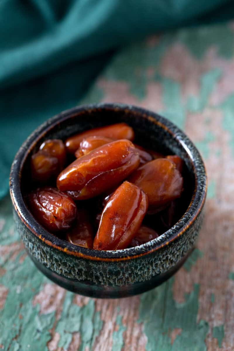 dried dates on a beautiful wooden background